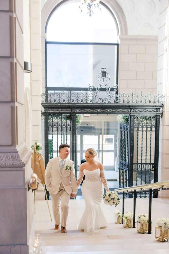 bride and groom entering reception